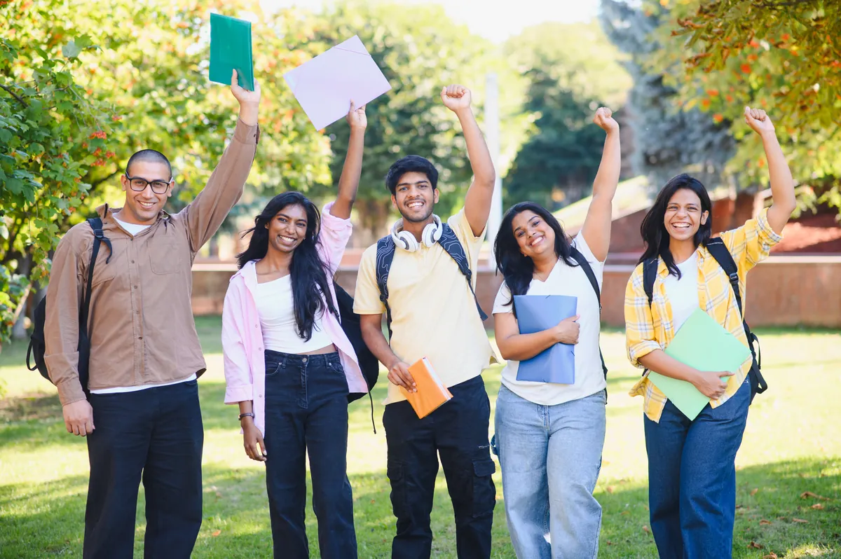 Students celebrating college admission success